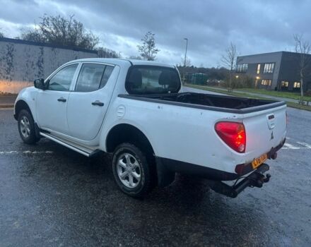 Красный Мицубиси Л 200, объемом двигателя 0 л и пробегом 98 тыс. км за 7044 $, фото 2 на Automoto.ua