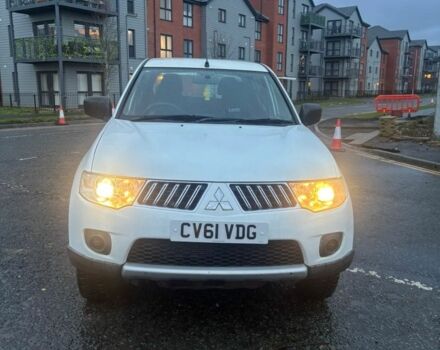 Красный Мицубиси Л 200, объемом двигателя 0 л и пробегом 98 тыс. км за 7044 $, фото 1 на Automoto.ua