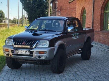 Мицубиси Л 200 2004 в Харькове на Automoto.ua Красный Мицубиси Л 200, объемом двигателя 2.5 л и пробегом 250 тыс. км за 2000 $, фото 1 на Automoto.ua