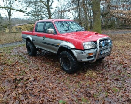 Красный Мицубиси Л 200, объемом двигателя 0 л и пробегом 243 тыс. км за 5100 $, фото 1 на Automoto.ua