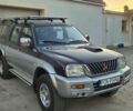 Серый Мицубиси Л 200, объемом двигателя 0 л и пробегом 315 тыс. км за 3450 $, фото 1 на Automoto.ua