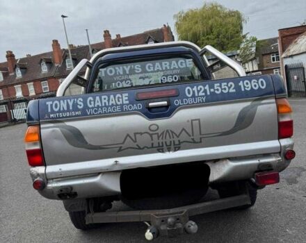 Серый Мицубиси Л 200, объемом двигателя 2.5 л и пробегом 180 тыс. км за 6200 $, фото 3 на Automoto.ua