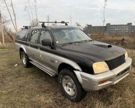 Серый Мицубиси Л 200, объемом двигателя 2.5 л и пробегом 258 тыс. км за 4500 $, фото 1 на Automoto.ua