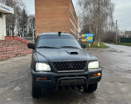 Серый Мицубиси Л 200, объемом двигателя 2.5 л и пробегом 100 тыс. км за 4700 $, фото 1 на Automoto.ua