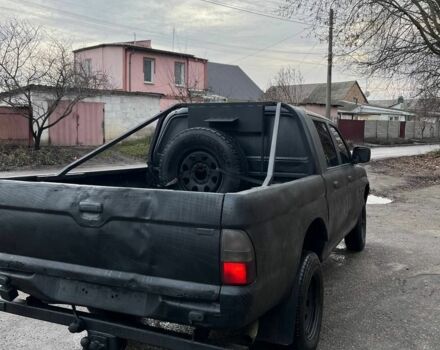 Серый Мицубиси Л 200, объемом двигателя 2.5 л и пробегом 100 тыс. км за 4700 $, фото 3 на Automoto.ua