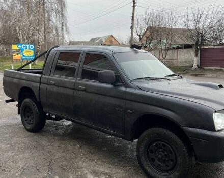 Серый Мицубиси Л 200, объемом двигателя 2.5 л и пробегом 100 тыс. км за 4700 $, фото 2 на Automoto.ua