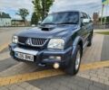 Серый Мицубиси Л 200, объемом двигателя 2.5 л и пробегом 100 тыс. км за 7856 $, фото 4 на Automoto.ua