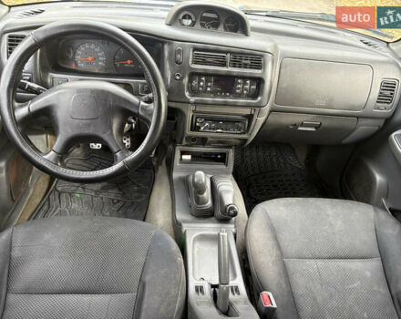 Серый Мицубиси Л 200, объемом двигателя 2.5 л и пробегом 260 тыс. км за 6669 $, фото 7 на Automoto.ua