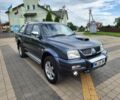 Серый Мицубиси Л 200, объемом двигателя 2.5 л и пробегом 100 тыс. км за 7856 $, фото 2 на Automoto.ua