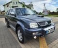 Серый Мицубиси Л 200, объемом двигателя 2.5 л и пробегом 100 тыс. км за 7856 $, фото 1 на Automoto.ua