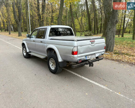 Серый Мицубиси Л 200, объемом двигателя 2.5 л и пробегом 260 тыс. км за 6669 $, фото 3 на Automoto.ua