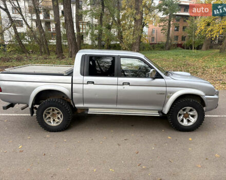 Серый Мицубиси Л 200, объемом двигателя 2.5 л и пробегом 260 тыс. км за 6669 $, фото 1 на Automoto.ua