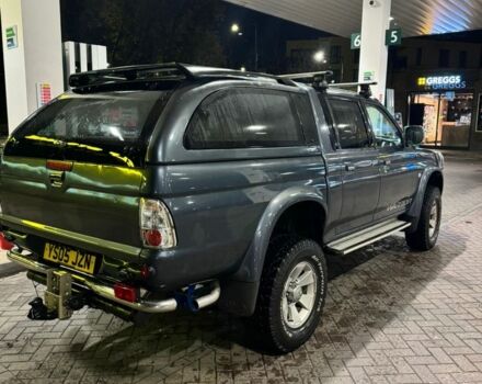 Серый Мицубиси Л 200, объемом двигателя 2.5 л и пробегом 100 тыс. км за 6185 $, фото 3 на Automoto.ua