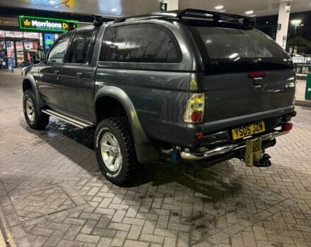 Серый Мицубиси Л 200, объемом двигателя 2.5 л и пробегом 100 тыс. км за 6185 $, фото 2 на Automoto.ua