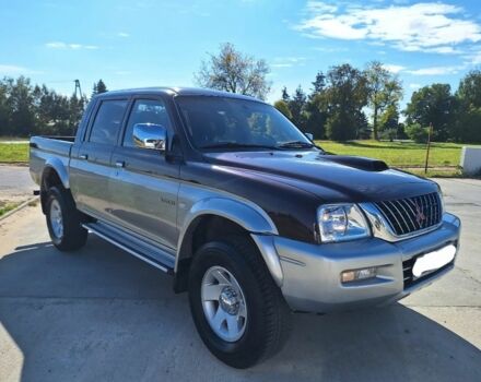 Серый Мицубиси Л 200, объемом двигателя 2.5 л и пробегом 247 тыс. км за 2600 $, фото 1 на Automoto.ua