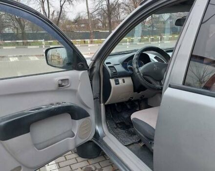 Серый Мицубиси Л 200, объемом двигателя 2.48 л и пробегом 397 тыс. км за 9000 $, фото 3 на Automoto.ua