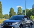 Серый Мицубиси Л 200, объемом двигателя 2.4 л и пробегом 206 тыс. км за 27895 $, фото 1 на Automoto.ua