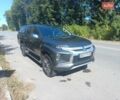Серый Мицубиси Л 200, объемом двигателя 2.44 л и пробегом 57 тыс. км за 34500 $, фото 2 на Automoto.ua