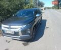 Серый Мицубиси Л 200, объемом двигателя 2.44 л и пробегом 57 тыс. км за 34500 $, фото 1 на Automoto.ua