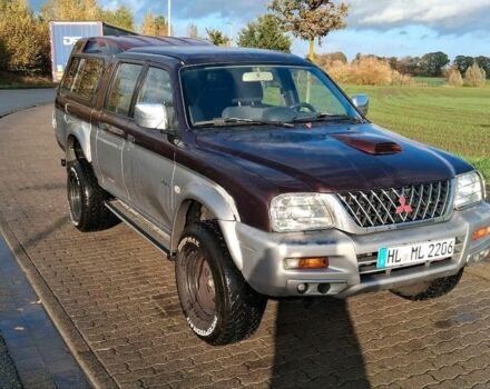 Серый Мицубиси Л 200, объемом двигателя 2.5 л и пробегом 183 тыс. км за 2500 $, фото 1 на Automoto.ua