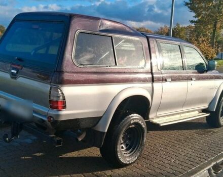 Серый Мицубиси Л 200, объемом двигателя 2.5 л и пробегом 183 тыс. км за 2500 $, фото 2 на Automoto.ua