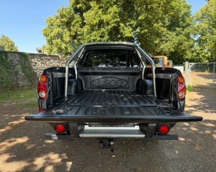 Серый Мицубиси Л 200, объемом двигателя 2.5 л и пробегом 210 тыс. км за 2950 $, фото 7 на Automoto.ua