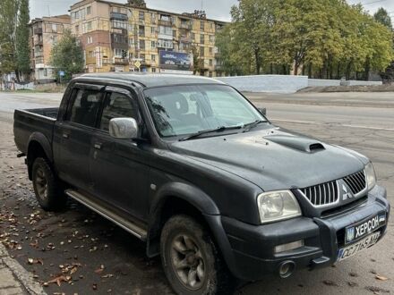 Серый Мицубиси Л 200, объемом двигателя 2.5 л и пробегом 280 тыс. км за 3500 $, фото 1 на Automoto.ua