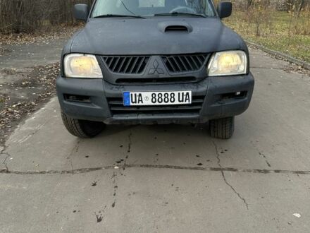 Серый Мицубиси Л 200, объемом двигателя 2.2 л и пробегом 200 тыс. км за 3550 $, фото 1 на Automoto.ua