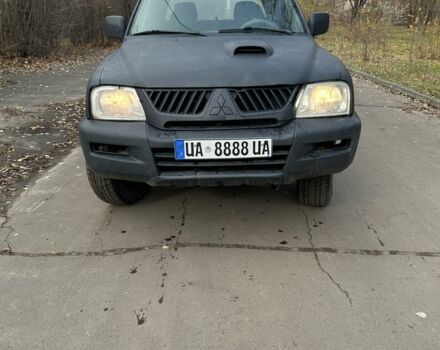 Серый Мицубиси Л 200, объемом двигателя 2.2 л и пробегом 200 тыс. км за 3550 $, фото 1 на Automoto.ua