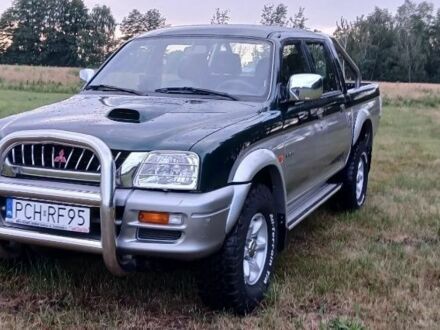 Серый Мицубиси Л 200, объемом двигателя 2.5 л и пробегом 223 тыс. км за 2650 $, фото 1 на Automoto.ua
