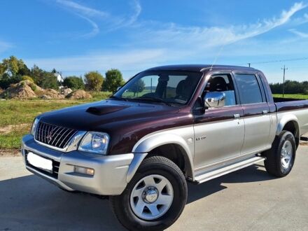 Серый Мицубиси Л 200, объемом двигателя 2.5 л и пробегом 244 тыс. км за 2650 $, фото 1 на Automoto.ua