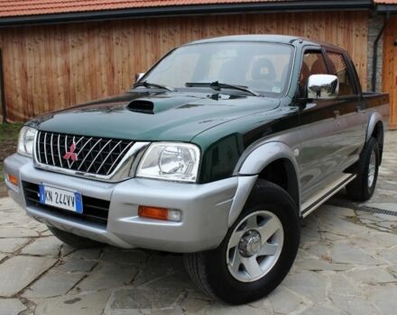 Серый Мицубиси Л 200, объемом двигателя 2.5 л и пробегом 240 тыс. км за 2600 $, фото 1 на Automoto.ua