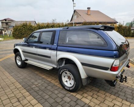 Синій Міцубісі Л 200, об'ємом двигуна 2.5 л та пробігом 105 тис. км за 7574 $, фото 8 на Automoto.ua