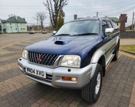 Синій Міцубісі Л 200, об'ємом двигуна 2.5 л та пробігом 105 тис. км за 7574 $, фото 6 на Automoto.ua