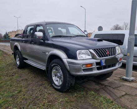 Синій Міцубісі Л 200, об'ємом двигуна 2.5 л та пробігом 250 тис. км за 6528 $, фото 1 на Automoto.ua