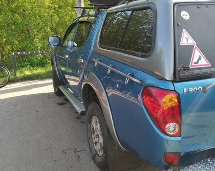 Синій Міцубісі Л 200, об'ємом двигуна 2.48 л та пробігом 224 тис. км за 12350 $, фото 5 на Automoto.ua