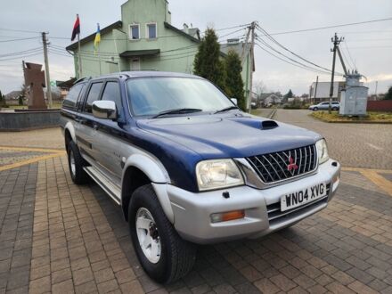 Синий Мицубиси Л 200, объемом двигателя 2.5 л и пробегом 105 тыс. км за 7574 $, фото 1 на Automoto.ua