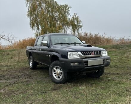 Синій Міцубісі Л 200, об'ємом двигуна 2.5 л та пробігом 321 тис. км за 4455 $, фото 1 на Automoto.ua