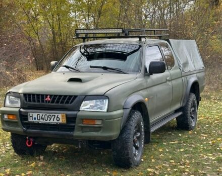 Зеленый Мицубиси Л 200, объемом двигателя 2.5 л и пробегом 280 тыс. км за 5700 $, фото 1 на Automoto.ua