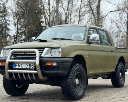 Зеленый Мицубиси Л 200, объемом двигателя 2.5 л и пробегом 197 тыс. км за 2600 $, фото 1 на Automoto.ua