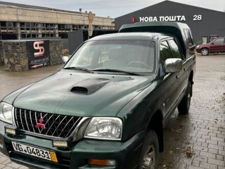 Зеленый Мицубиси Л 200, объемом двигателя 2.5 л и пробегом 380 тыс. км за 4875 $, фото 1 на Automoto.ua