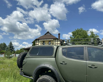 Оранжевый Мицубиси Л 200, объемом двигателя 2.48 л и пробегом 122 тыс. км за 18000 $, фото 1 на Automoto.ua