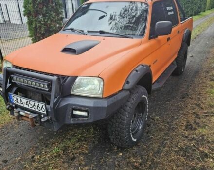 Помаранчевий Міцубісі Л 200, об'ємом двигуна 2.5 л та пробігом 199 тис. км за 2864 $, фото 1 на Automoto.ua