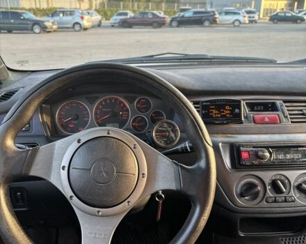 Белый Мицубиси Лансер Эволюшн, объемом двигателя 0 л и пробегом 179 тыс. км за 21499 $, фото 6 на Automoto.ua