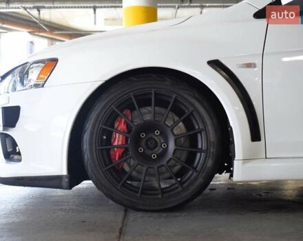 Білий Міцубісі Лансер Еволюшн, об'ємом двигуна 2 л та пробігом 96 тис. км за 24900 $, фото 14 на Automoto.ua