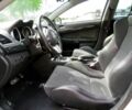 Белый Мицубиси Лансер Эволюшн, объемом двигателя 2 л и пробегом 86 тыс. км за 9900 $, фото 7 на Automoto.ua