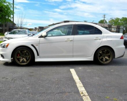 Белый Мицубиси Лансер Эволюшн, объемом двигателя 2 л и пробегом 86 тыс. км за 9900 $, фото 5 на Automoto.ua