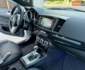 Белый Мицубиси Лансер Эволюшн, объемом двигателя 2 л и пробегом 110 тыс. км за 19850 $, фото 6 на Automoto.ua