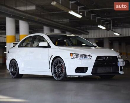 Білий Міцубісі Лансер Еволюшн, об'ємом двигуна 2 л та пробігом 96 тис. км за 24900 $, фото 1 на Automoto.ua