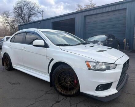 Белый Мицубиси Лансер Эволюшн, объемом двигателя 2 л и пробегом 82 тыс. км за 6400 $, фото 1 на Automoto.ua